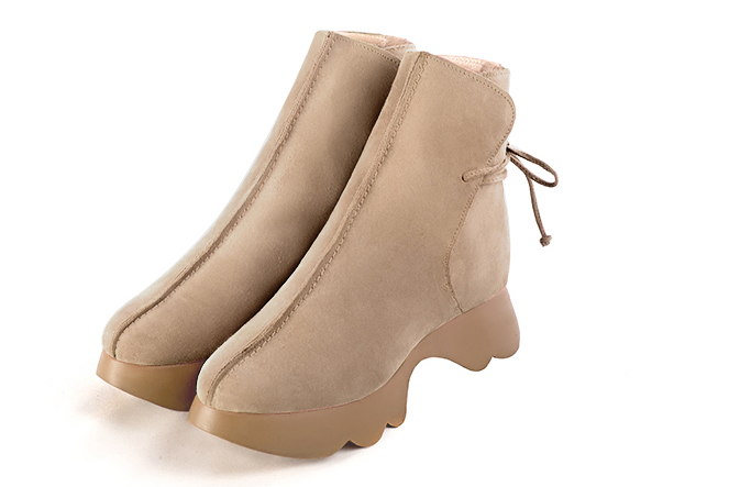 French elegance and refinement for these tan beige dress booties with laces at the back, 
                available in many subtle leather and colour combinations. This charming ankle boot with its back lacing fits snugly around the ankle.
Its rubber sole ensures comfort and originality.
Customise or not, with your choice of materials and colours.  
                Matching clutches for parties, ceremonies and weddings.   
                You can customize these lace-up ankle boots to perfectly match your tastes or needs, and have a unique model.  
                Choice of leathers, colours, knots and heels. 
                Wide range of materials and shades carefully chosen.  
                Rich collection of flat, low, mid and high heels.  
                Small and large shoe sizes